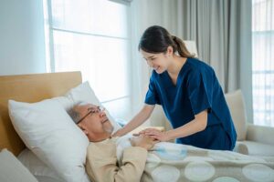 An adult child and senior sharing a warm moment in a comfortable, personalized assisted living room.